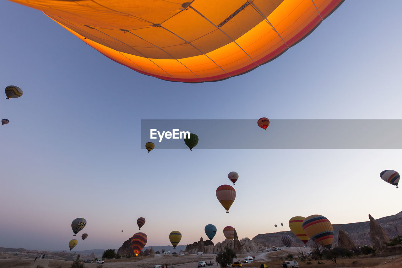 Low angle view of hot air balloons against sky