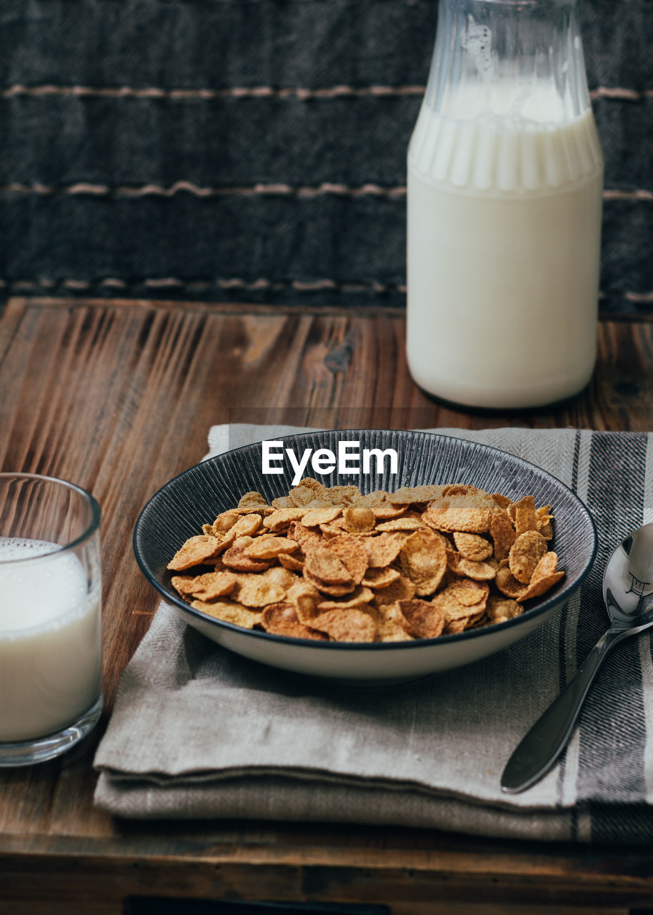 Close-up of cerial and milk on table