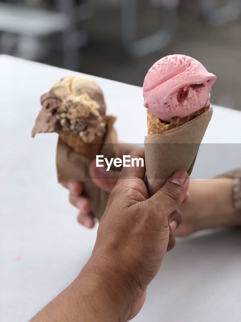 Close-up of hand holding ice cream cone