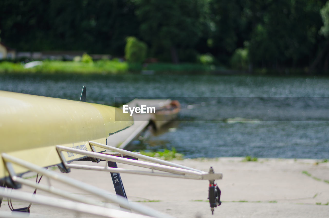 Canoe moored at lakeshore