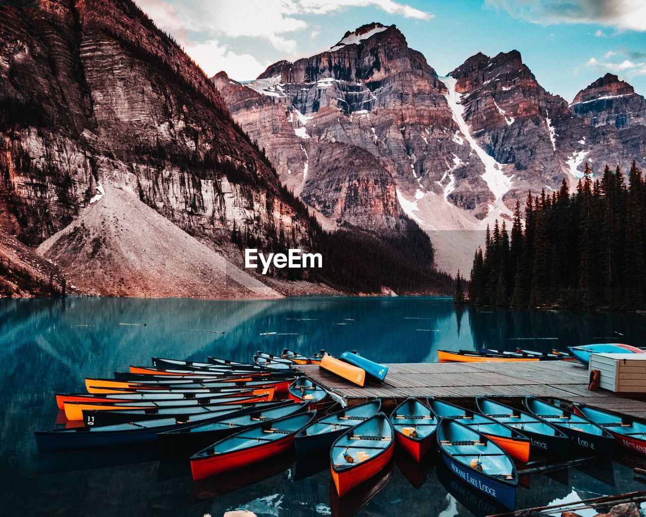 BOATS MOORED ON LAKE