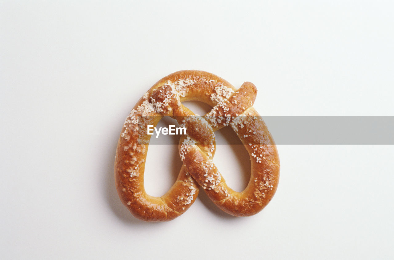 HIGH ANGLE VIEW OF BREAD ON WHITE SURFACE