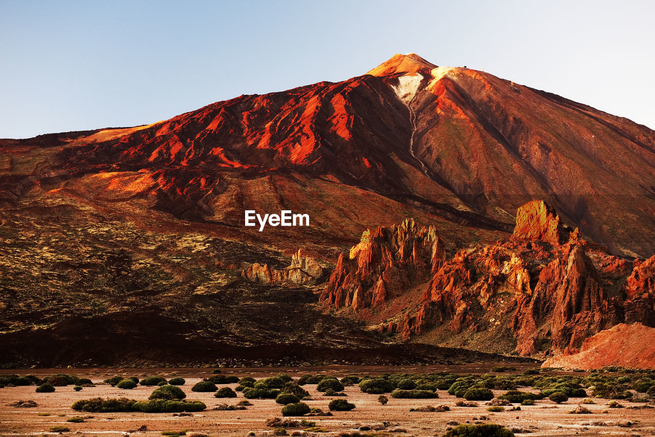 Scenic view of rocky mountains at el teide national park against clear sky