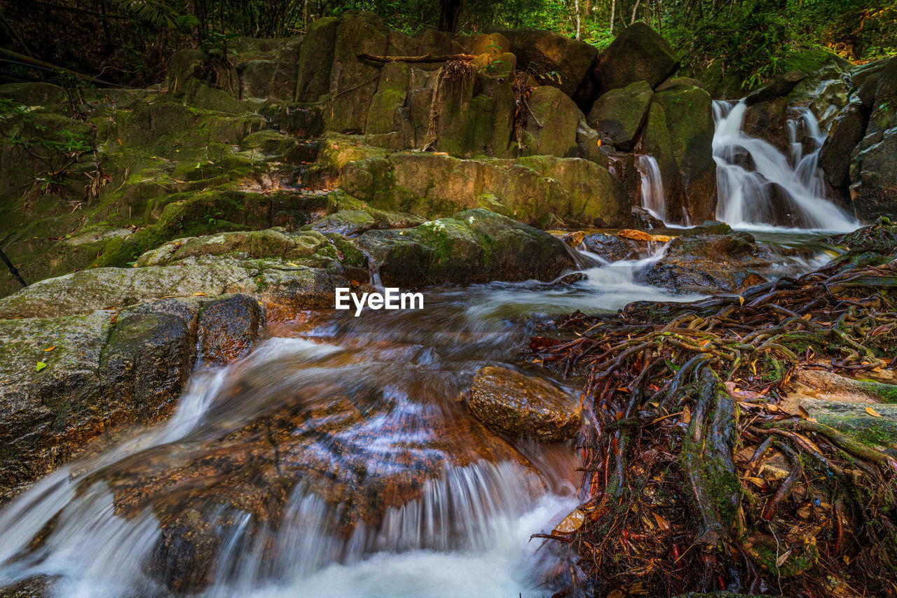 STREAM FLOWING THROUGH ROCKS