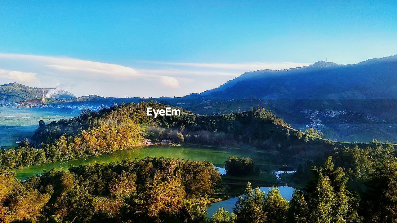 Scenic view of lake and mountains against sky