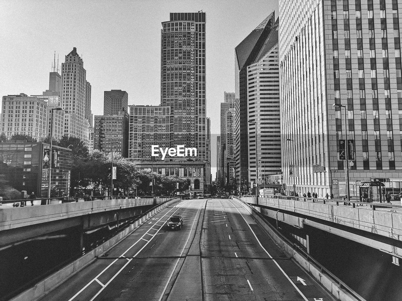 Street amidst buildings against sky in city