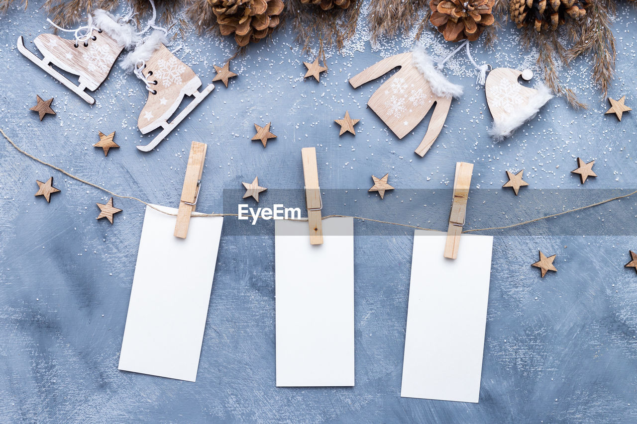 Directly above shot of blank adhesive notes with christmas decorations on table