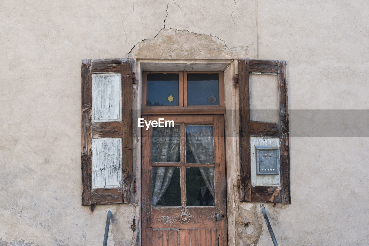 Old wooden weathered door. exterior of old building