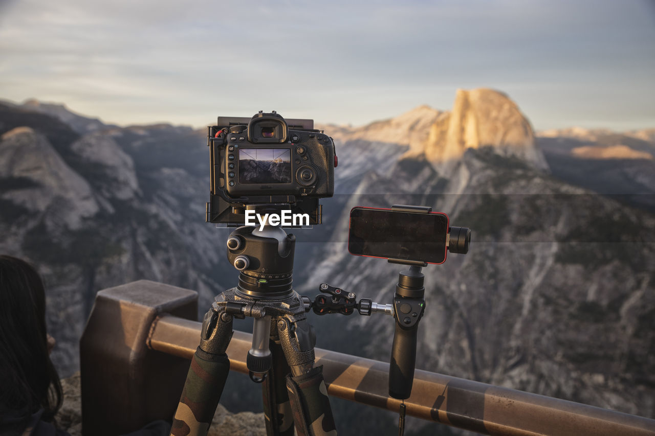 Filming and photographing half dome from glacier point