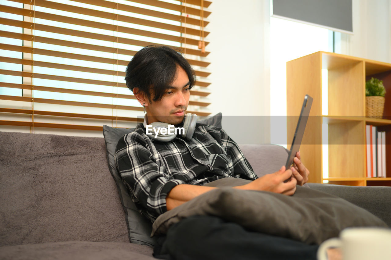 young man using mobile phone