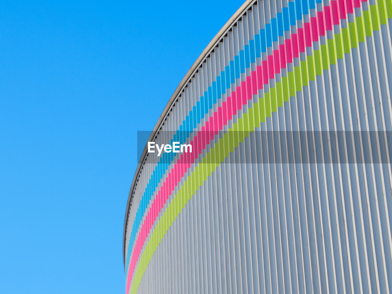 Low angle view of building against clear blue sky