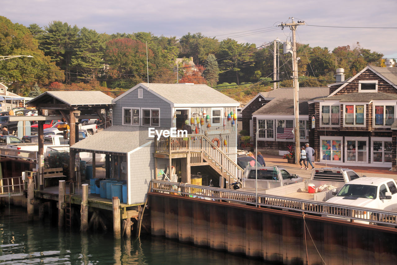 architecture, water, built structure, building exterior, building, transportation, house, nautical vessel, vehicle, waterway, town, nature, city, mode of transportation, river, residential district, boat, travel destinations, travel, harbor, waterfront, body of water, boathouse, sky, tourism, no people, vacation, outdoors, day, dock, tree, watercraft, cloud, stilt house, plant, holiday, landscape