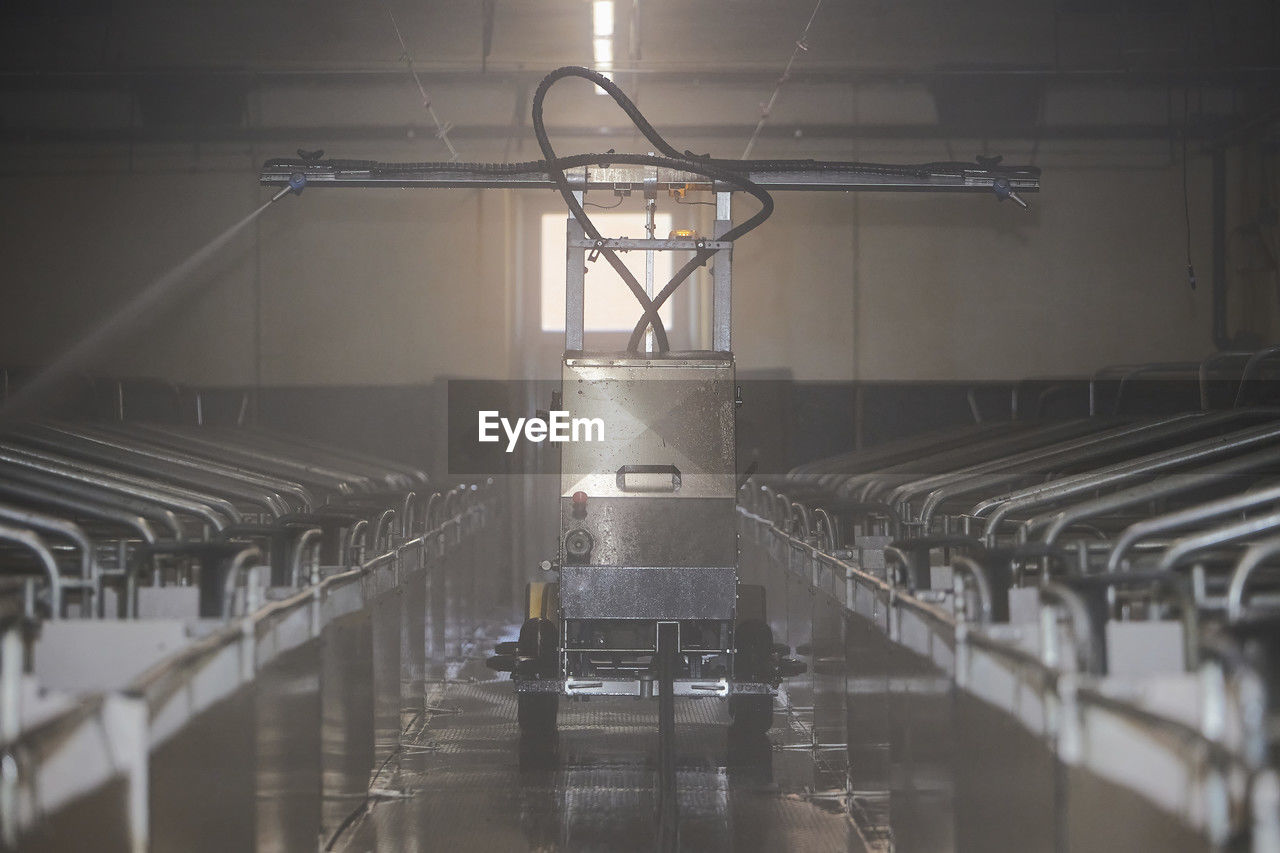 indoors, light, no people, in a row, sport venue, architecture, lighting, iron, metal, industry, technology, factory, absence