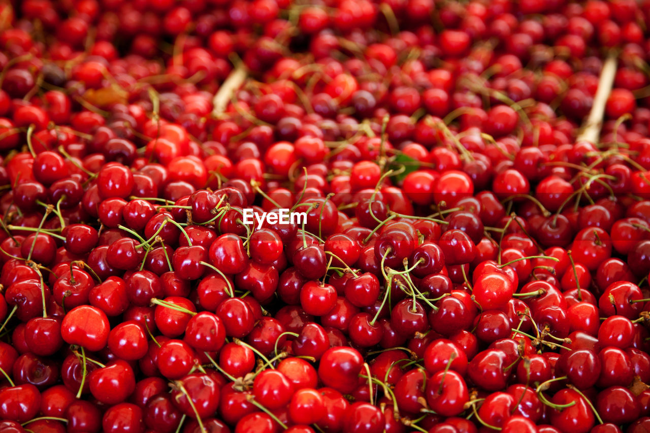 Full frame shot of fresh cherries for sale at market stall