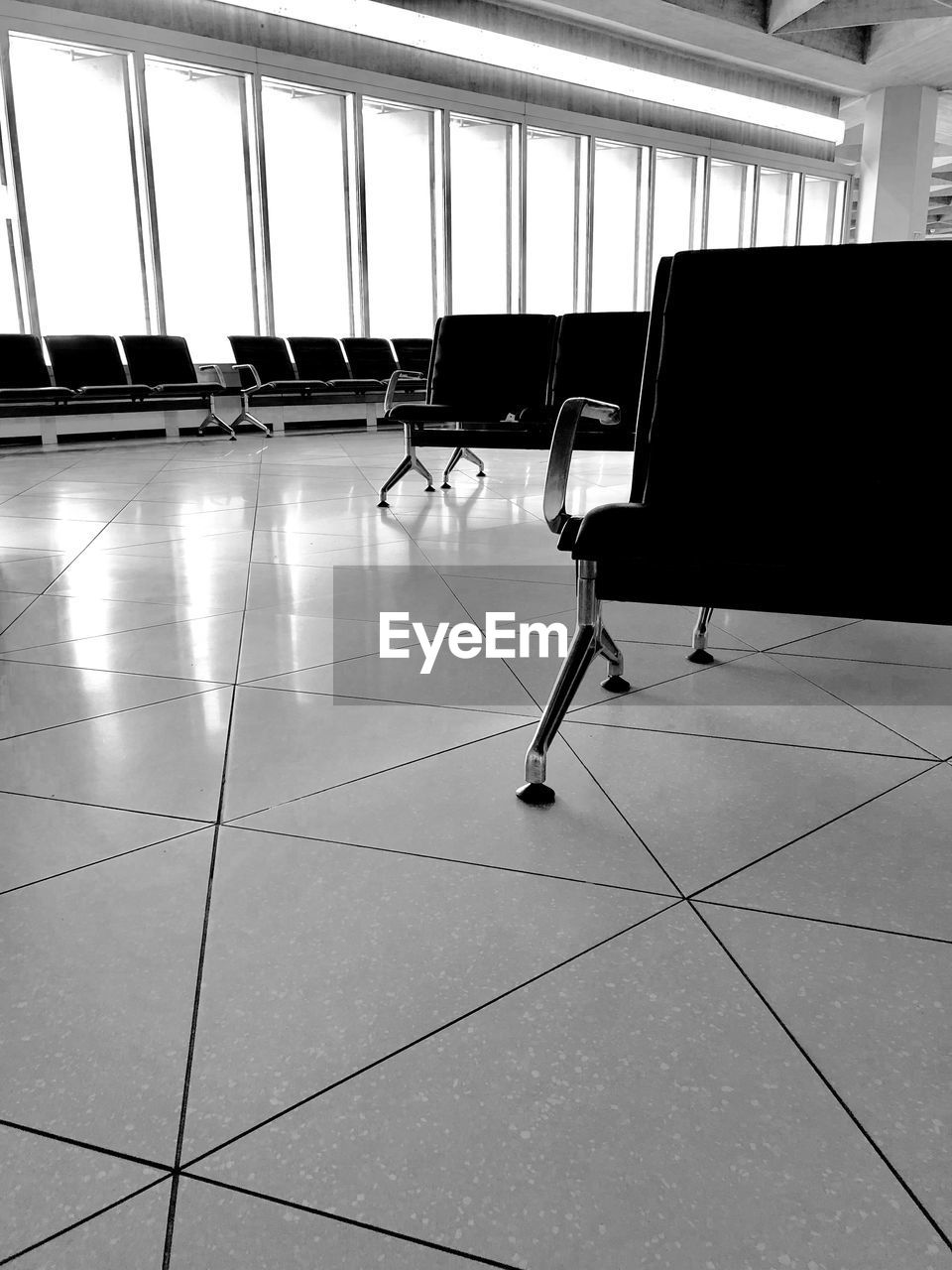 VIEW OF EMPTY CHAIRS IN AIRPORT