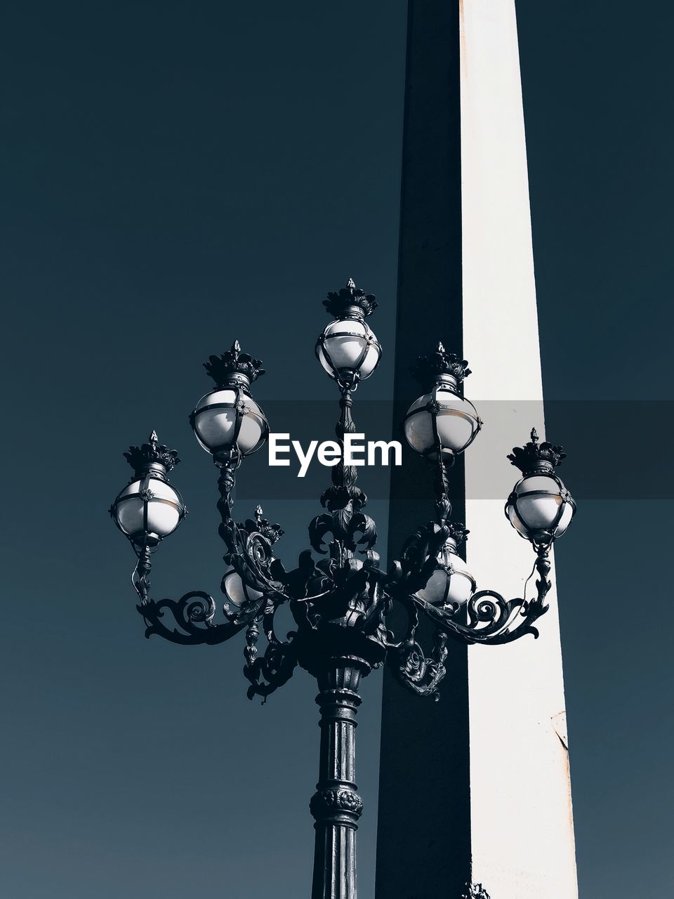 Low angle view of street light against sky