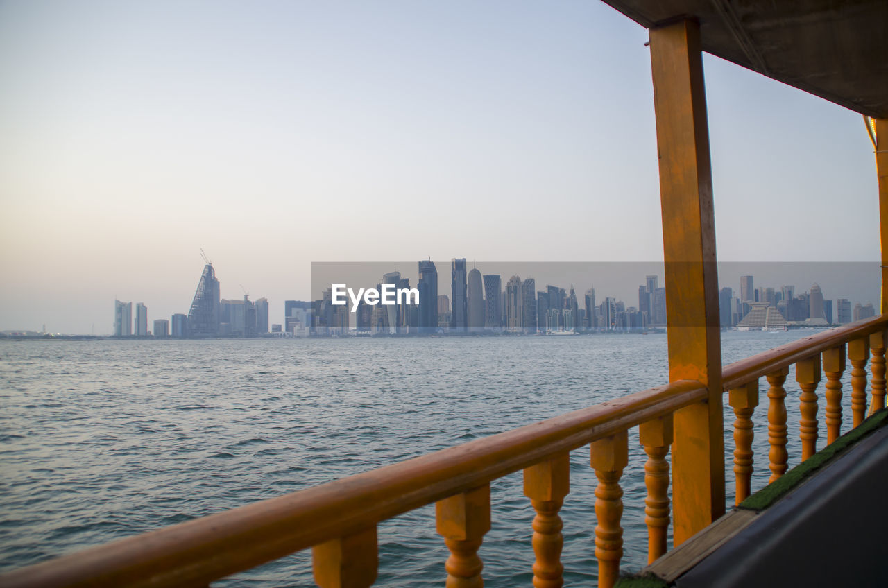 The view of doha's architecture / buildings from the dhow in the middle of the sea in qatar