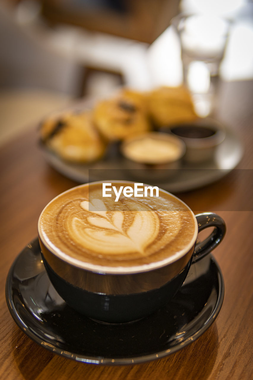 Close-up of cappuccino on table