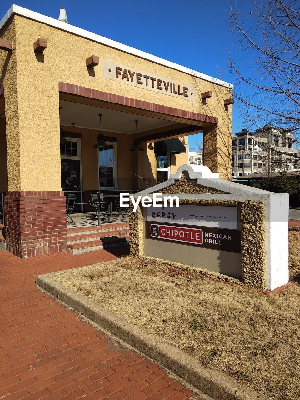 TEXT ON BUILDING AGAINST CLEAR SKY