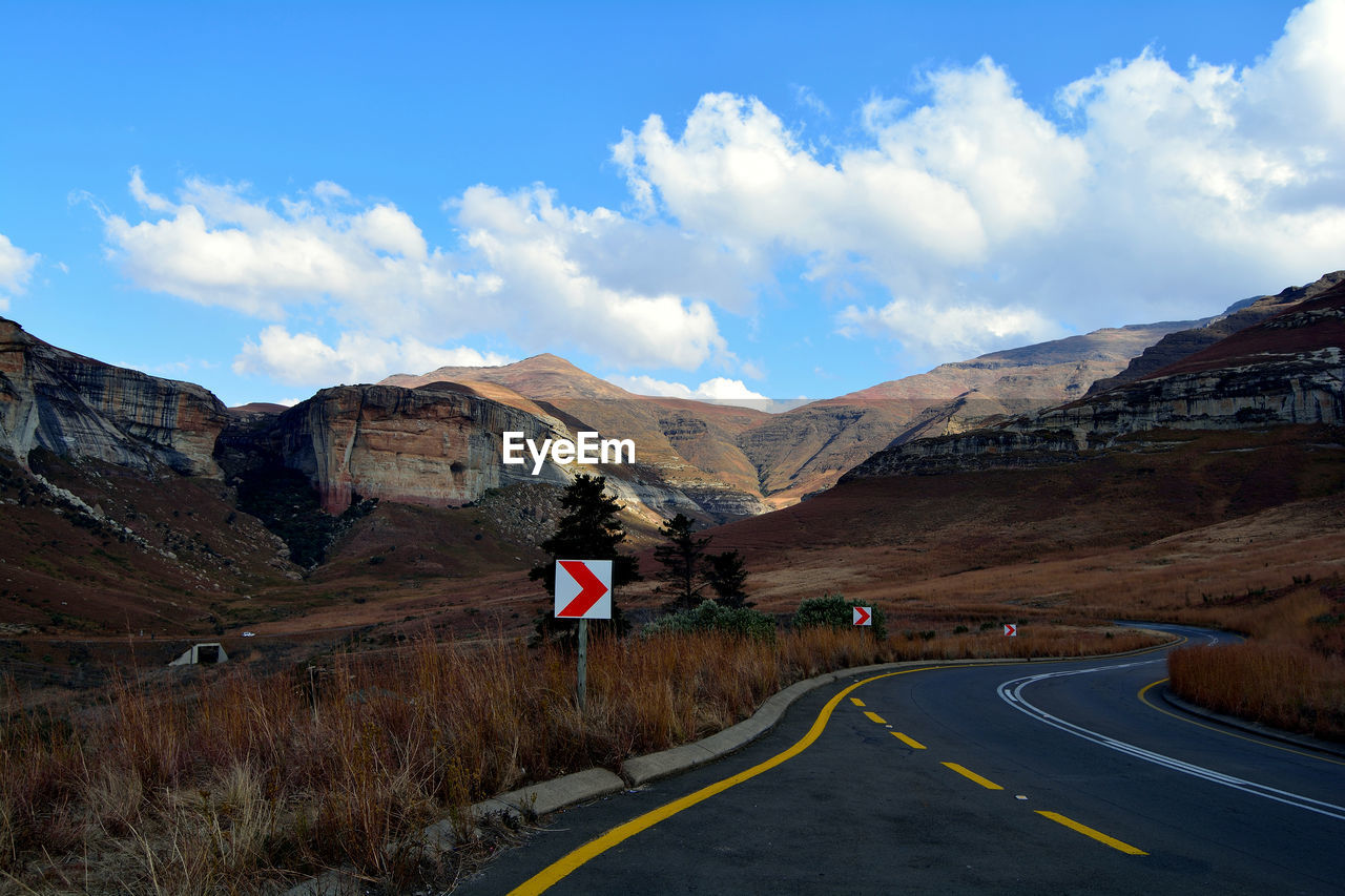 Scenic view of mountains against cloudy sky