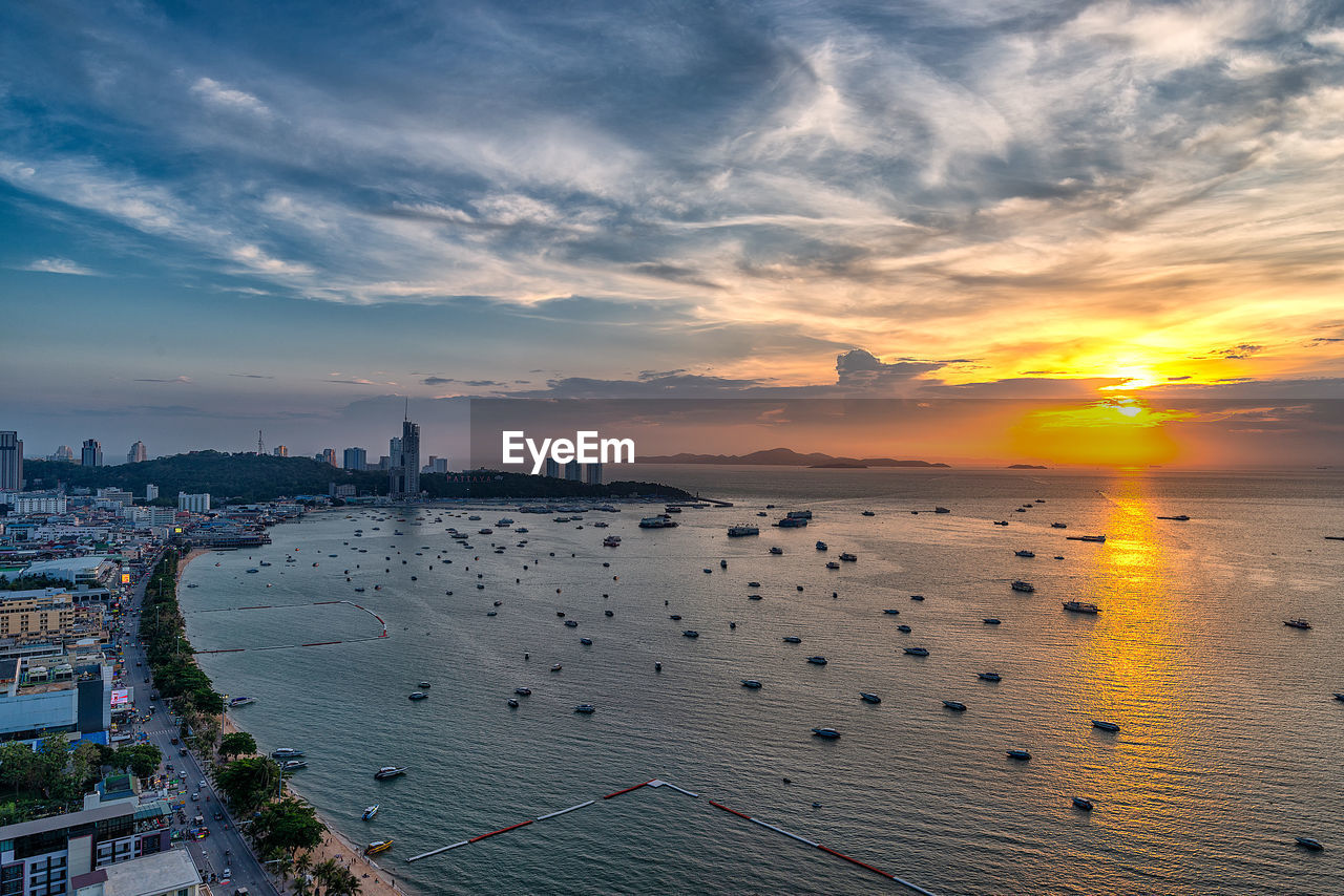 High angle view of city at sunset