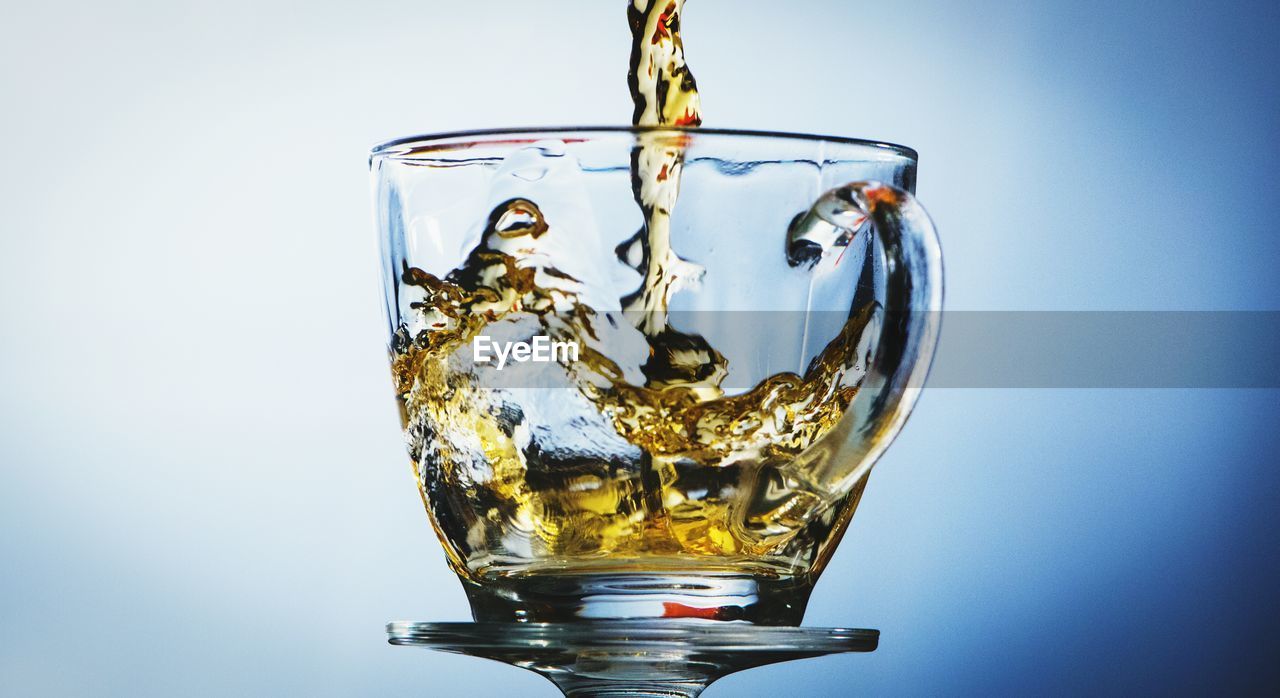 Beer pouring in glass