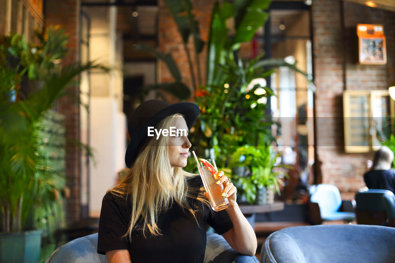 Young woman sitting in restaurant