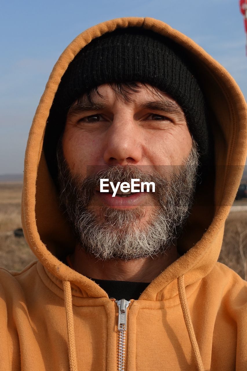 Close-up portrait of man wearing hood