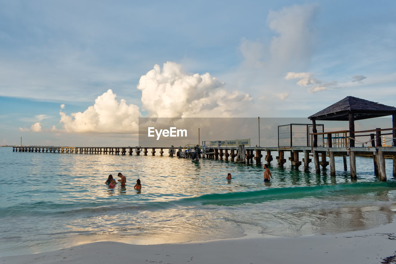 PEOPLE ON SWIMMING POOL AT BEACH