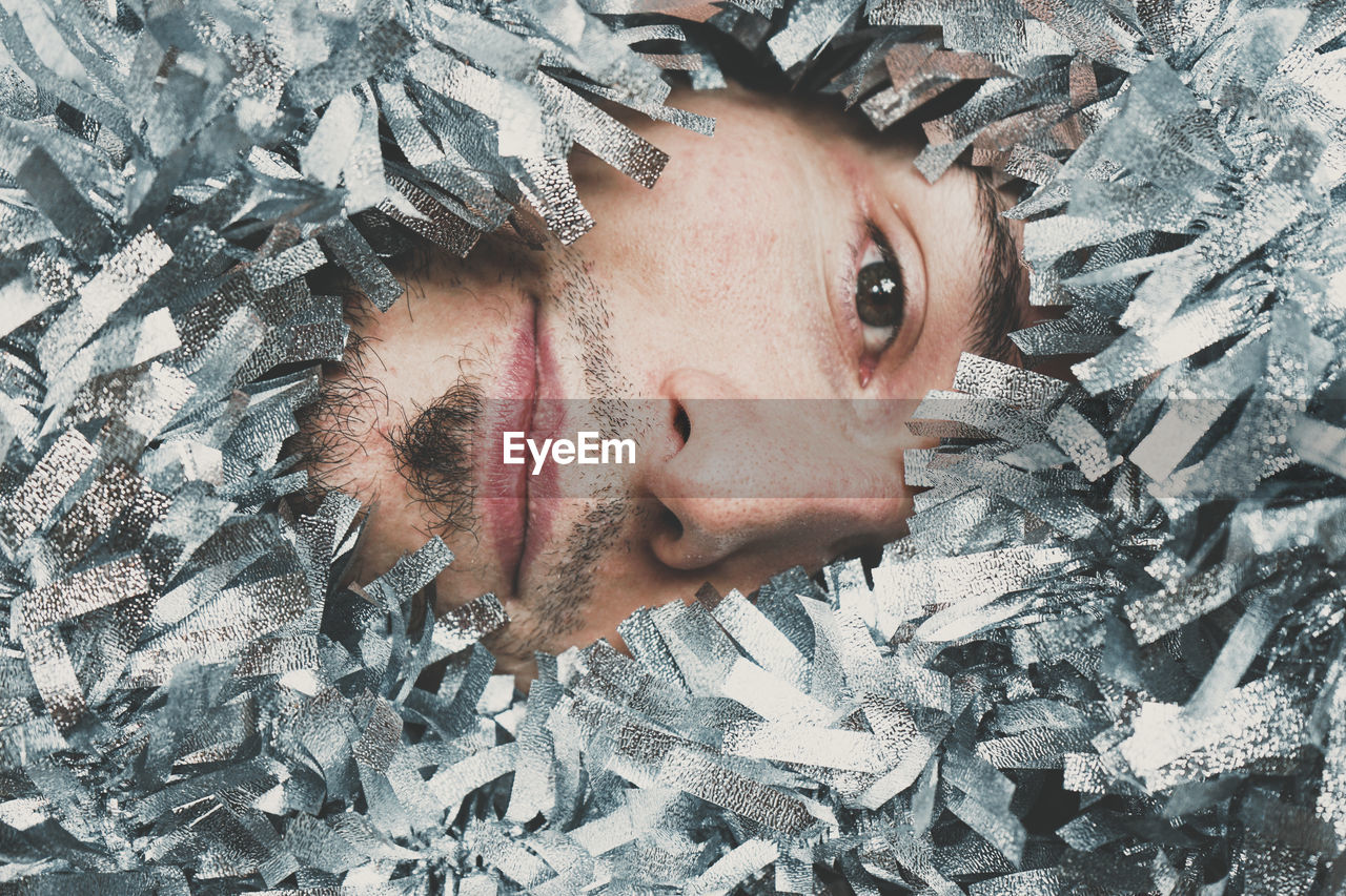 Close-up portrait of young man during winter