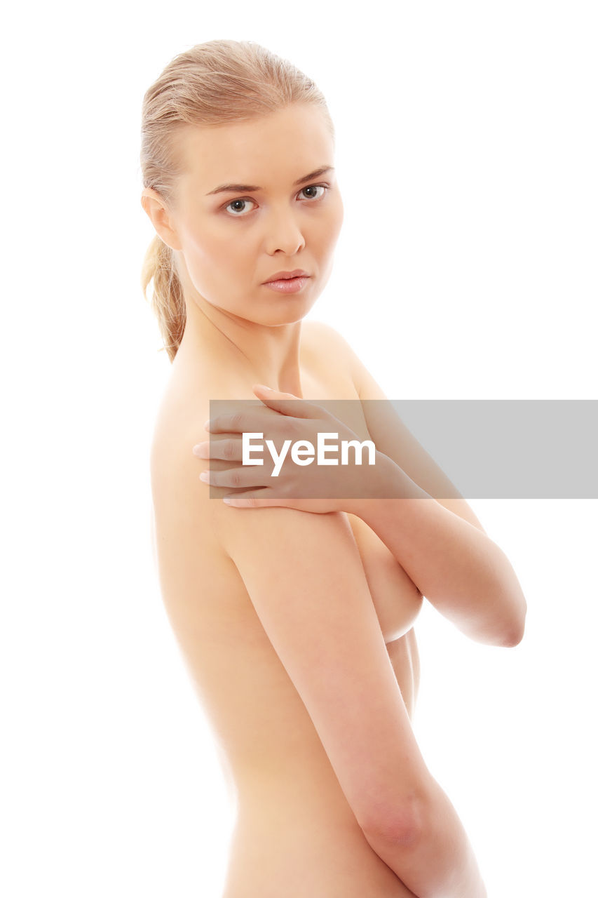Naked woman against white background