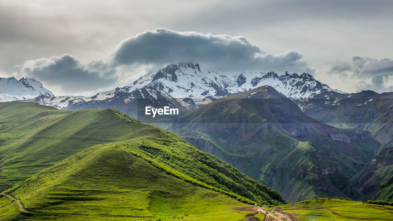 Scenic view of snowcapped mountains against sky