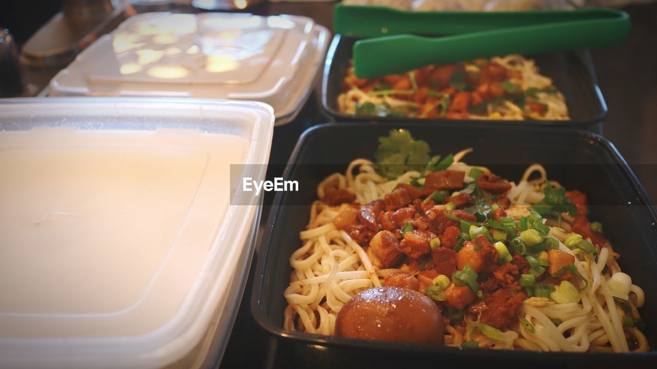 food, food and drink, lunch, meal, freshness, healthy eating, asian food, dish, indoors, wellbeing, cuisine, no people, vegetable, close-up, meat, business, restaurant, tray, container, pasta, fast food, high angle view, italian food