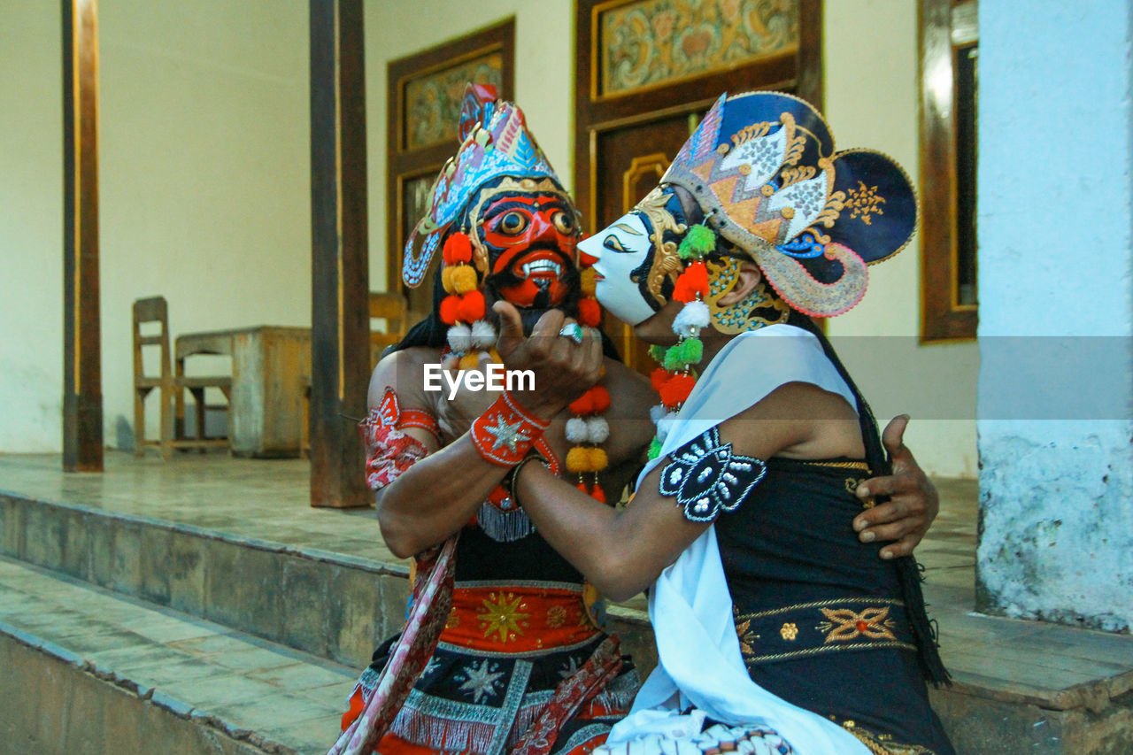 Close-up of men in costume outdoors