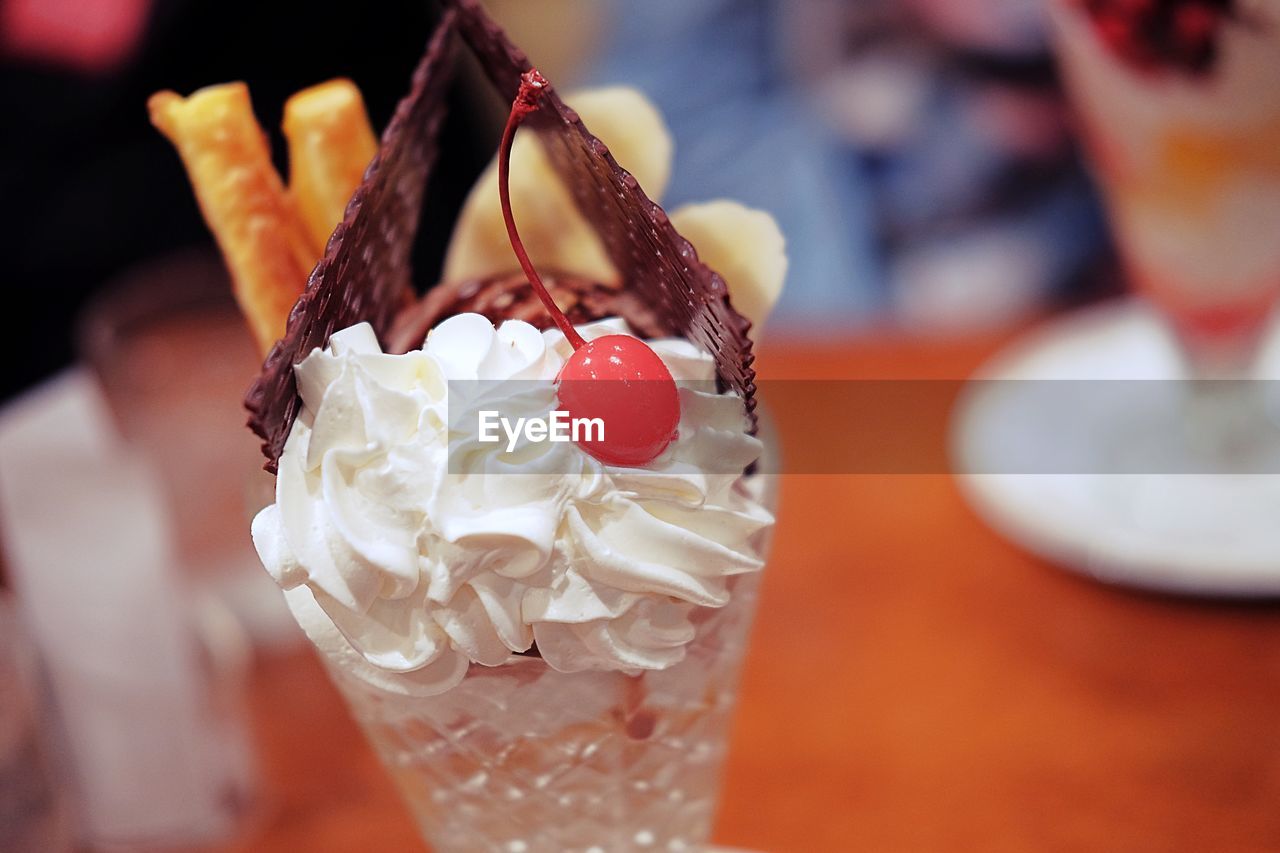 CLOSE-UP OF ICE CREAM IN GLASS