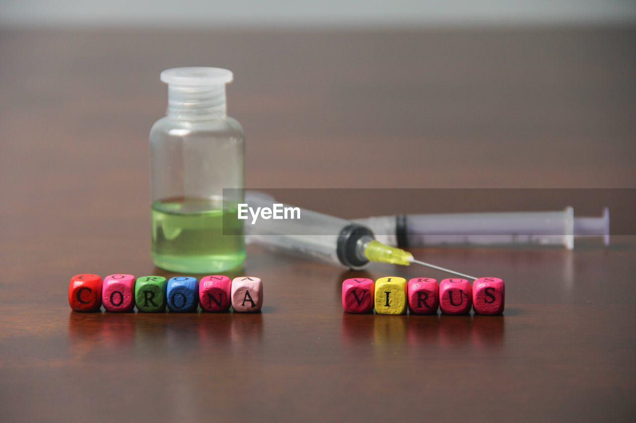 CLOSE-UP OF MULTI COLORED BOTTLES