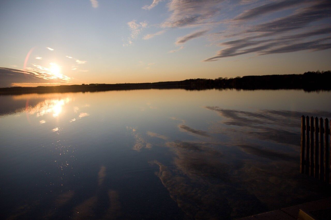 Scenic view of lake at sunset