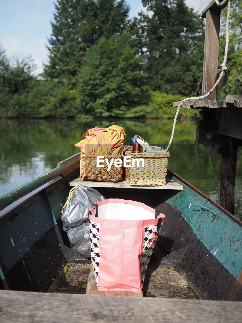 Picnic wicker baskets on boat in lake