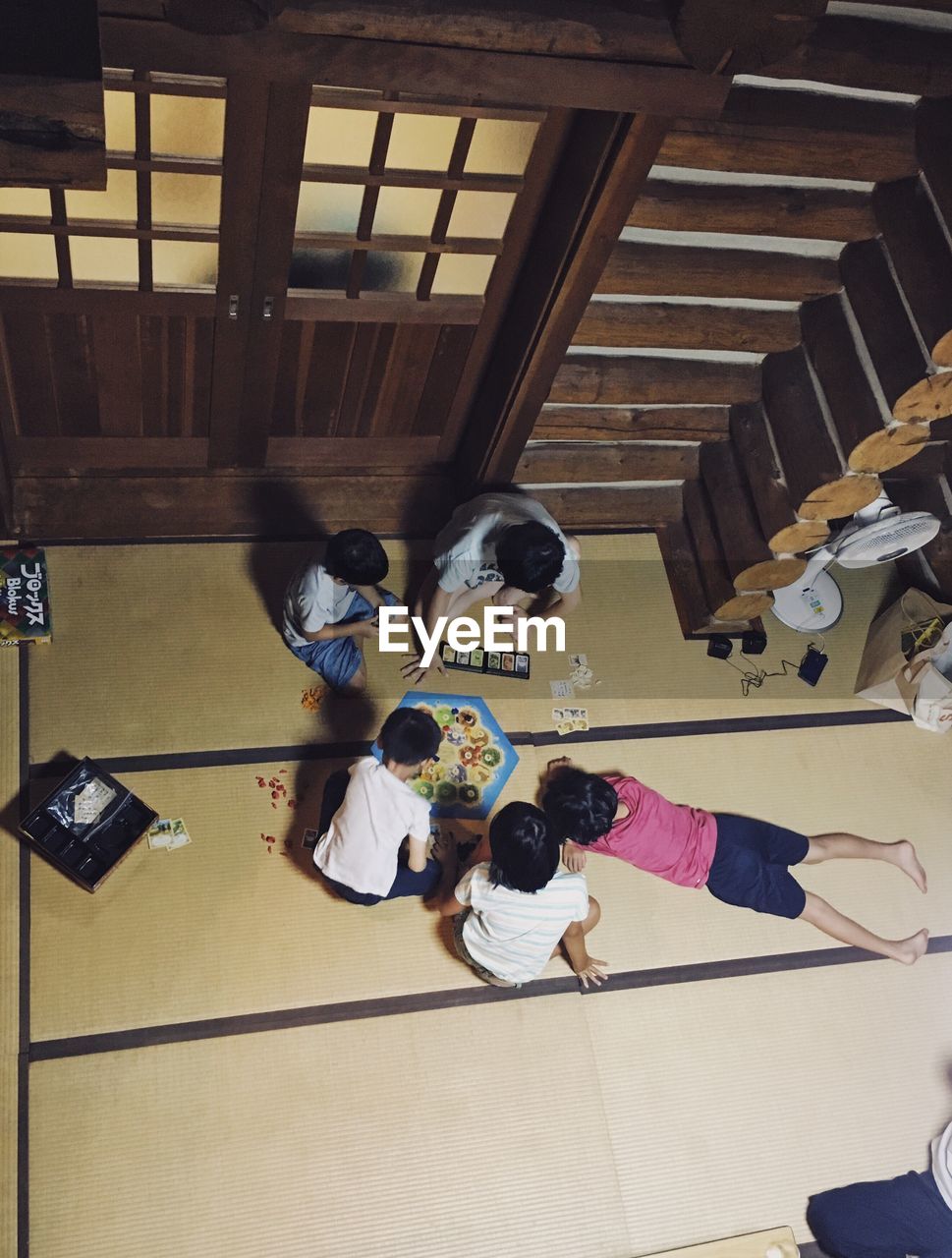 HIGH ANGLE VIEW OF PEOPLE STANDING IN KITCHEN