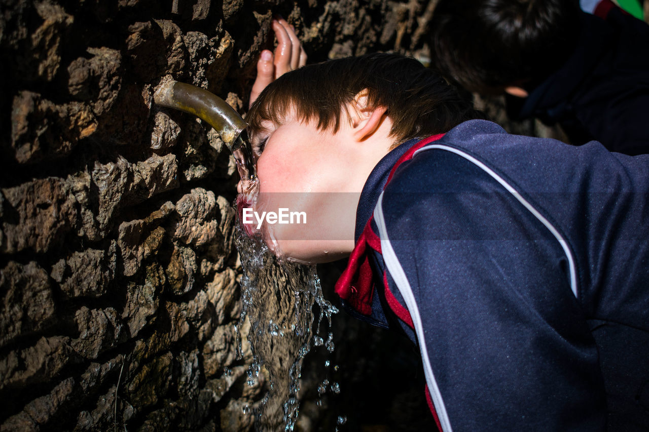 Close-up of boy drinking