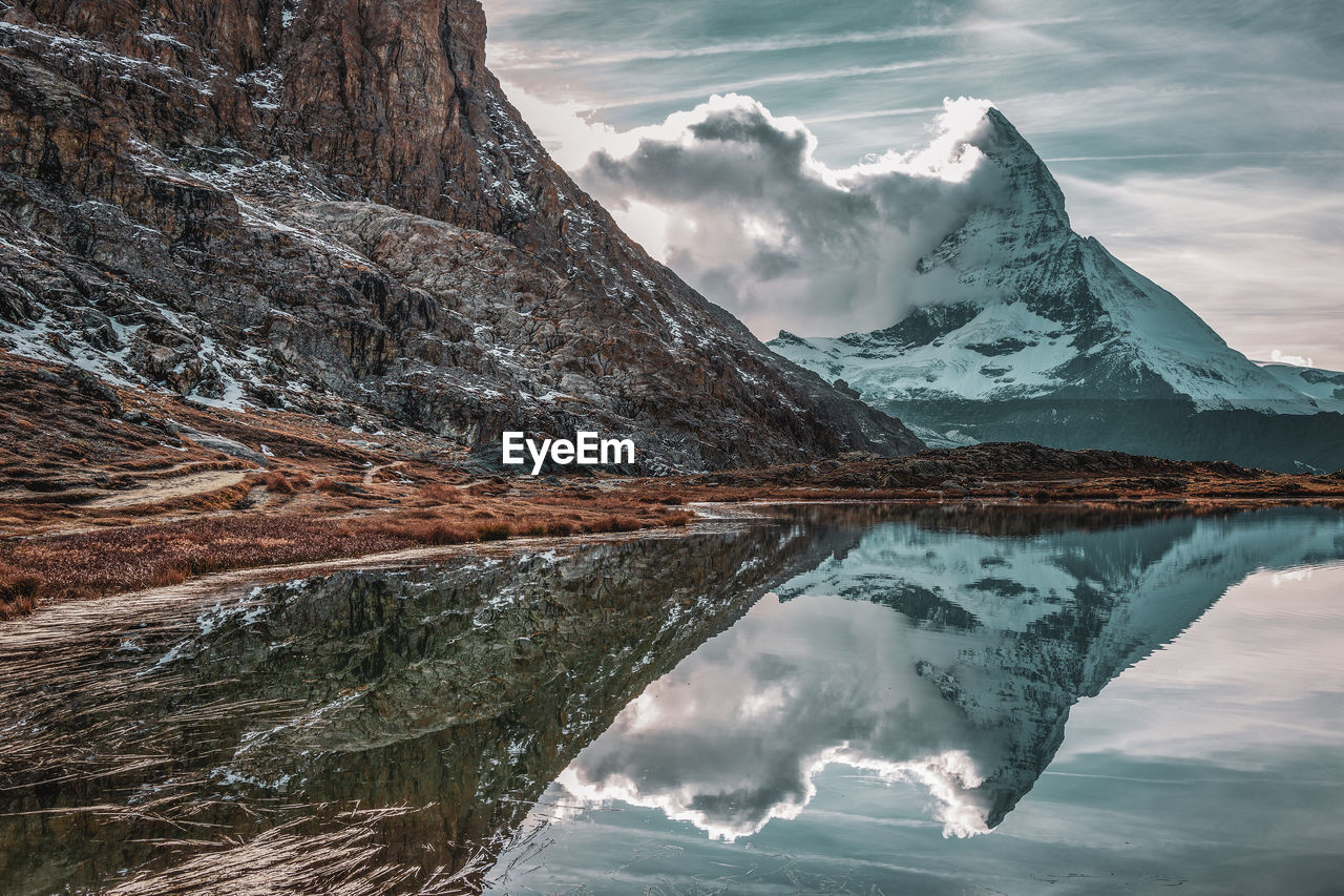 Panoramic view of matterhorn peak, switzerland. matterhorn reflection in the riffelsee.