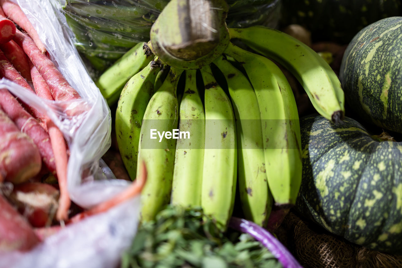 food and drink, food, healthy eating, freshness, wellbeing, market, vegetable, fruit, retail, abundance, produce, variation, organic, no people, market stall, large group of objects, raw food, plant, green, for sale, banana, business, close-up, business finance and industry, still life, outdoors, day