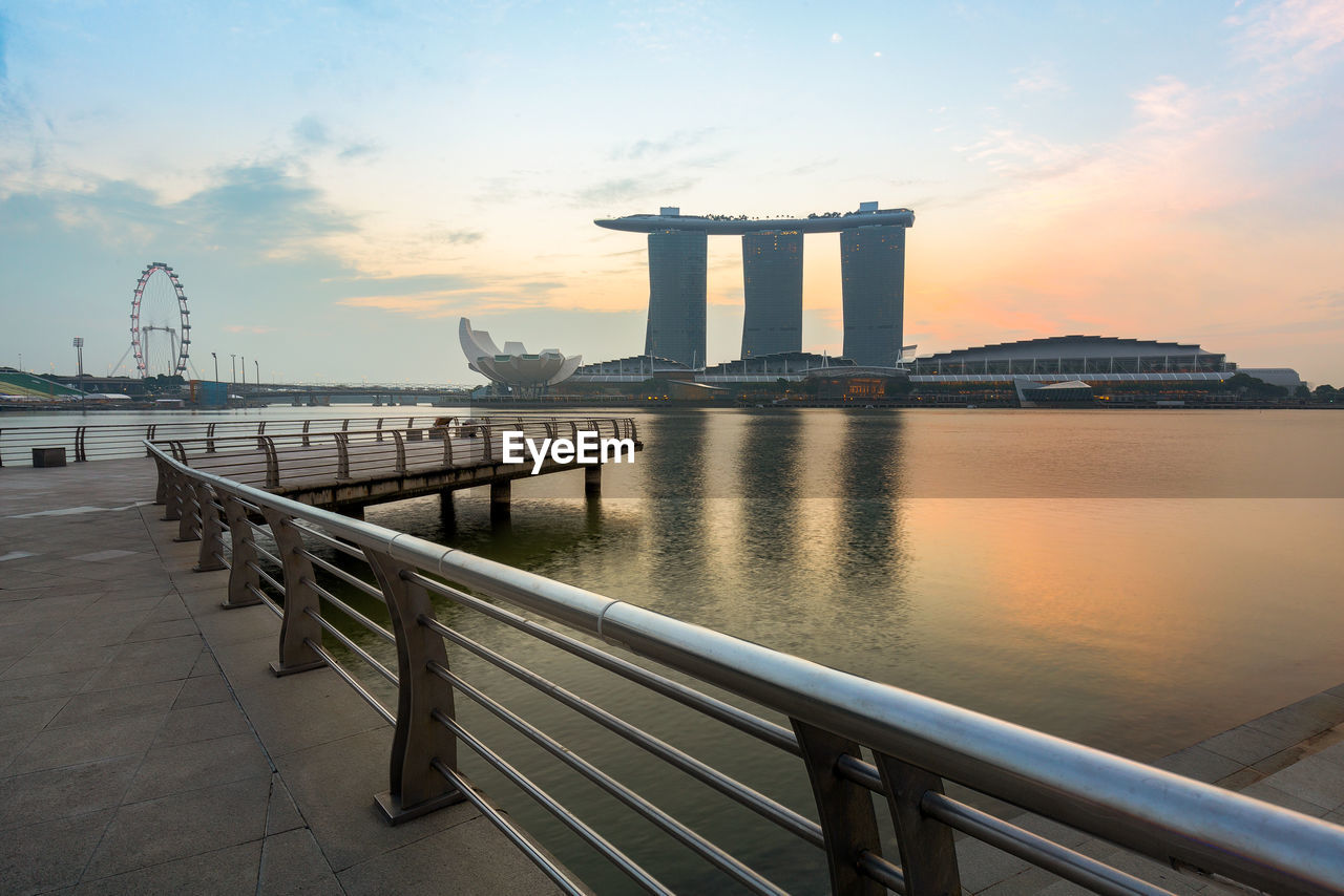 Marina bays sands hotel seen from pier during sunrise