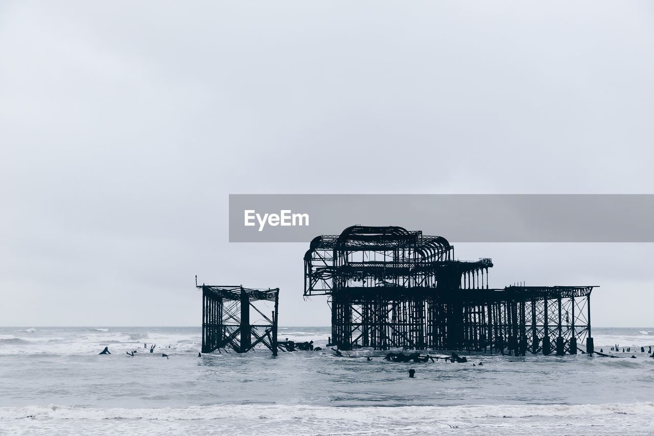 West pier on sea against clear sky at brighton