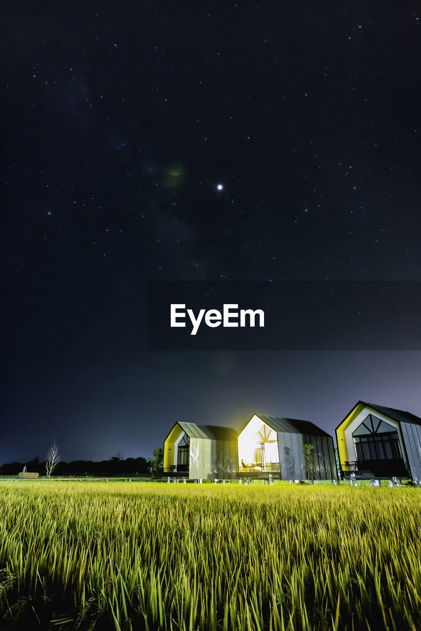 Scenic view of field against sky at night