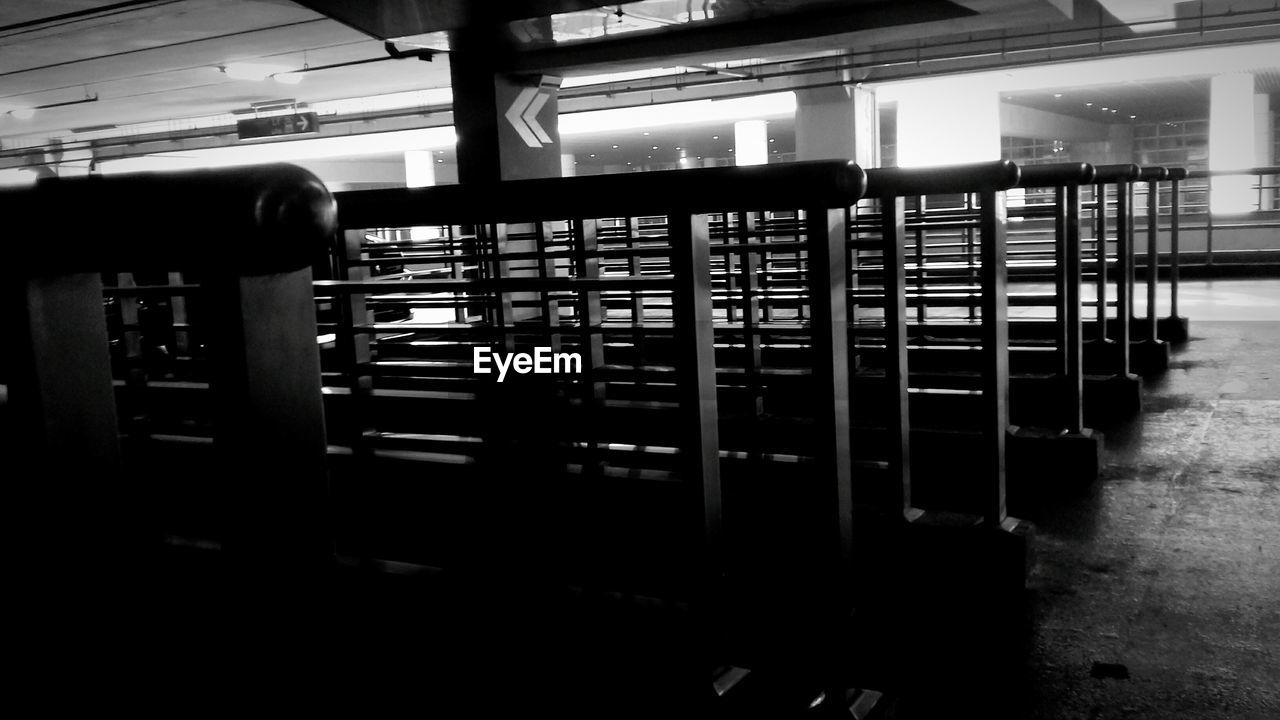 ROW OF BOOKS ON SHELF IN LIBRARY