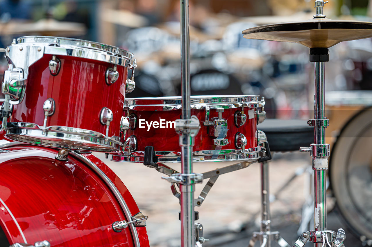 A set of plates in a drum set. at a concert of percussion music, selective focus, close-up