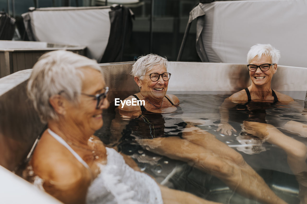 Happy female friends in spa