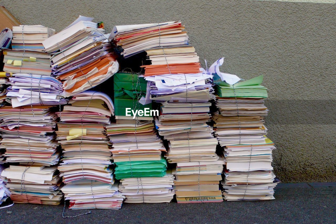 Stack of books against wall