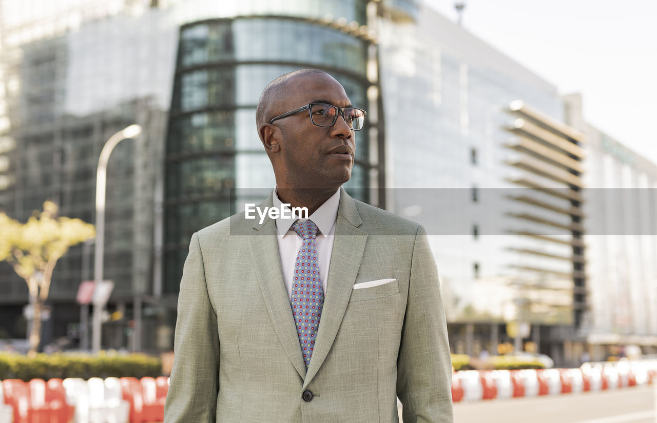 Mature businessman with eyeglasses in financial district